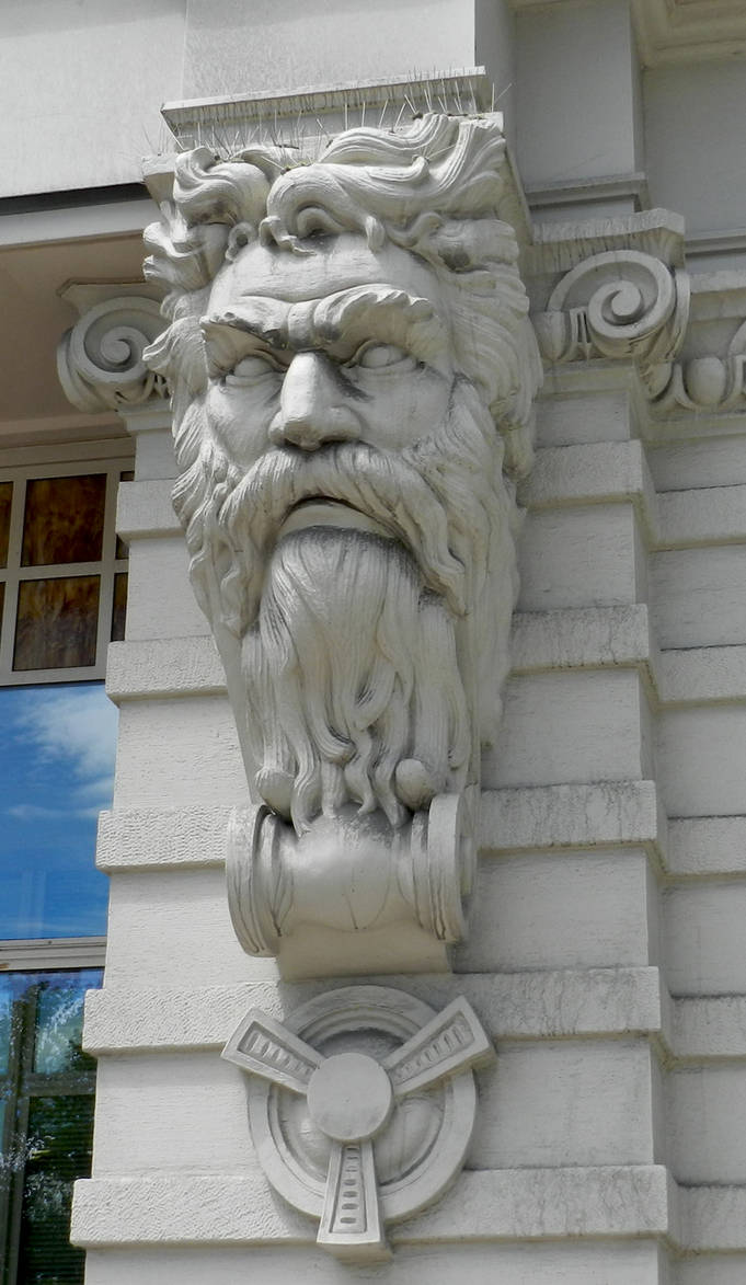 Stone Carved Man Face on Building by EveyD