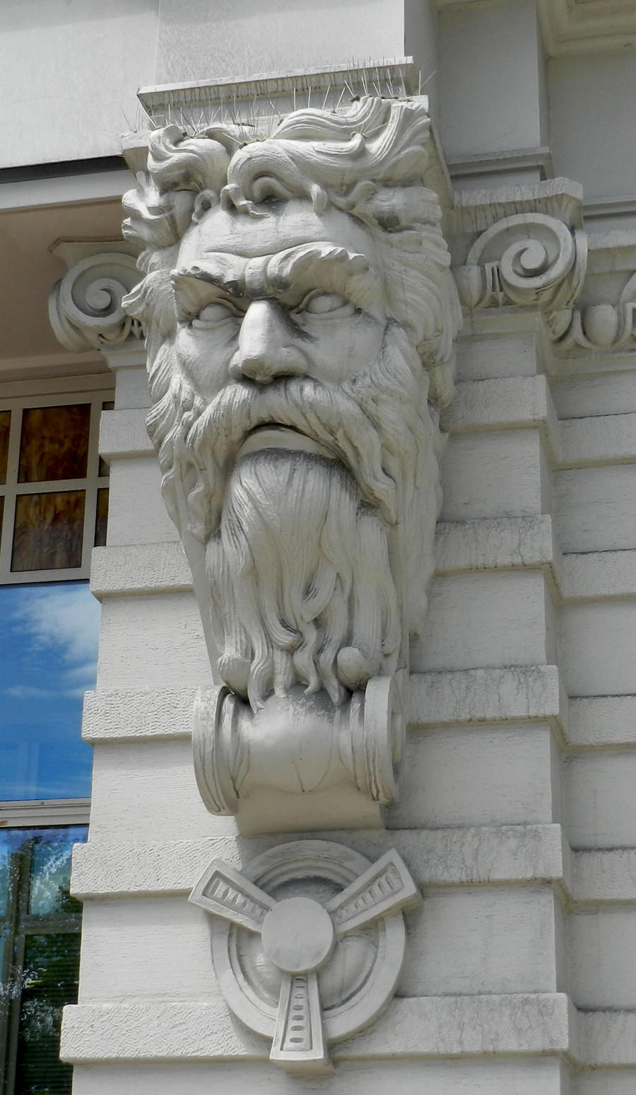 Stone Carved Man Face on Building by EveyD