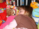 CC my puppy and I sleeping together on her doggy b