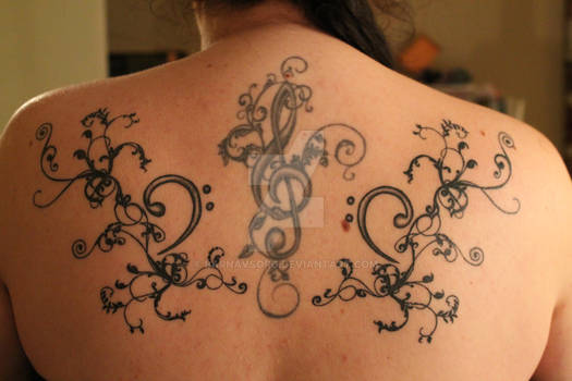 Treble and bass clef tattoos