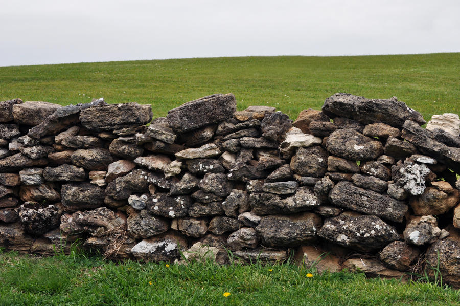 Grassy hilltop and old wall