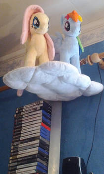 Two Pegasus Ponies on a Cloud Float Into a Bar