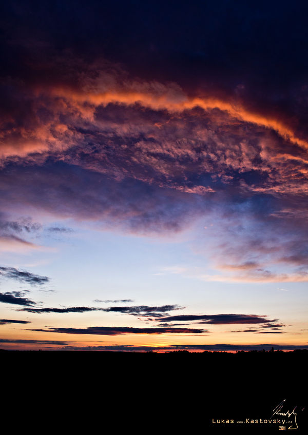 Sky over darkness