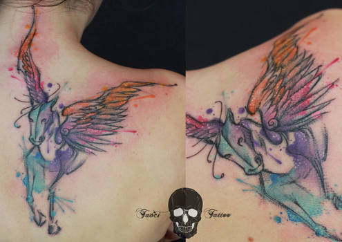 Abstract winged horse tattoo