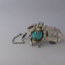 Silver scarab with swirly beads