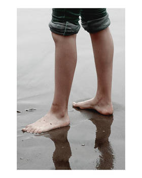 Feet in Wet Sand