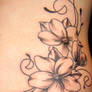 flower and swirls tattoo