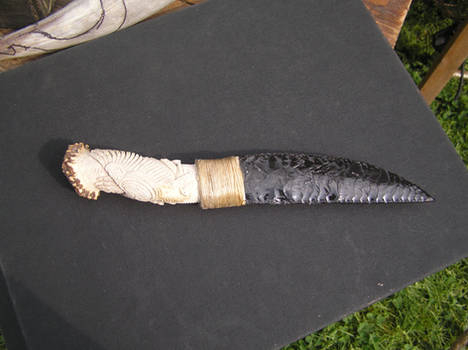 carved obsidian knife handle