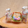 Easter decoration. Mouse couple wit basket full of