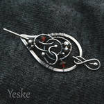 Dilya | Silver brooch with garnets (on cloth) by YeskeCrafts