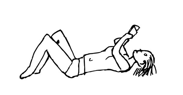 Woman reading on a bed - 2