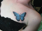 Butterfly tattoo on tit