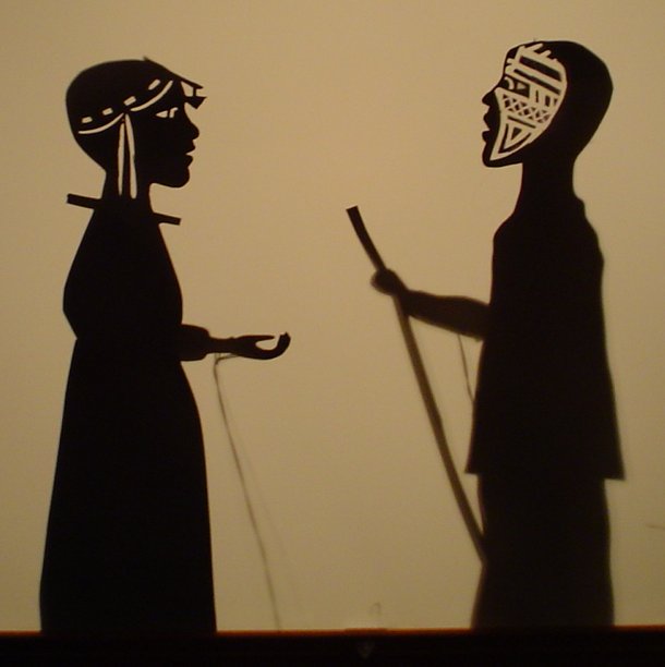 woman + warrior shadow puppets