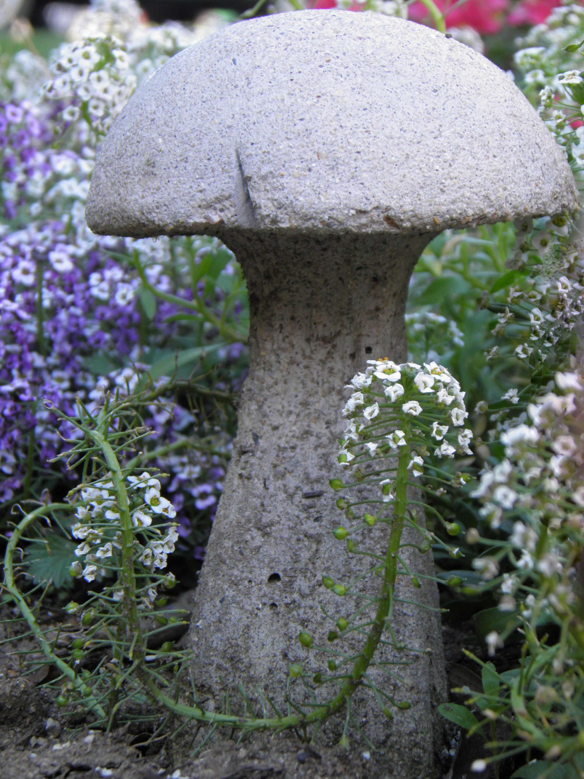 mushroom statue and flowers