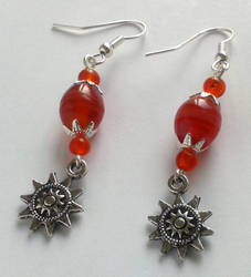 red glass pearls with silver sun filigrees