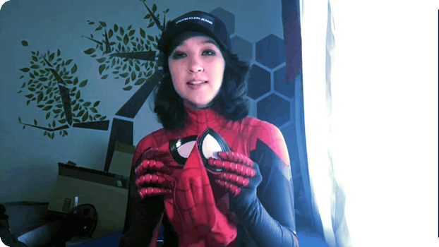 Girl puts on a Spider-Man mask without Faceshell