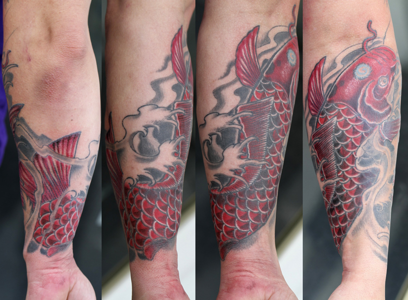 red koi fish on forearm