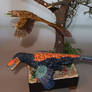 Juvenile and adult Deinonychus sculpture. Top view