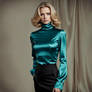 Beautiful woman in satin teal blouse