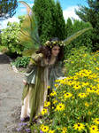 Giant Wings, smelling flowers by FaeryAzarelle