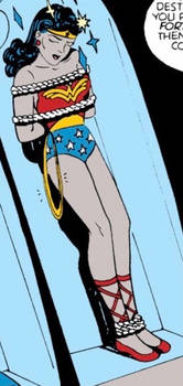 Wonder Woman tied to board