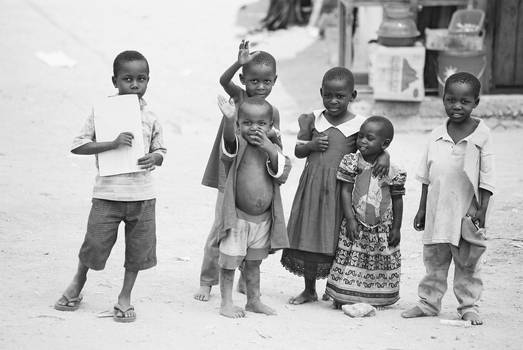 Happf African children waving