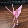 The origami crane does exercise the squat