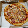 Pizza with Ham, Mushrooms, and Pineapple