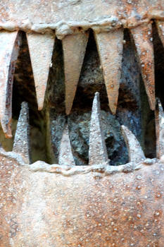 Face detail of a sculpture at Jurustic Park, Marsh