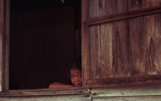 shy girl on the window