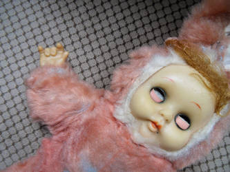 Spooky pink satanist doll