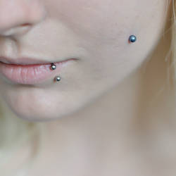 cheek piercing