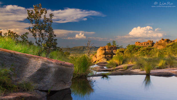 Dusk beyond the pools