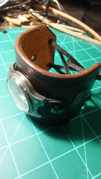 leather cuff with a timex