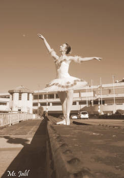 Model shot: ballerina on heavily trafficked bridge