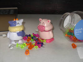 Oink and Moo eat some pushpins