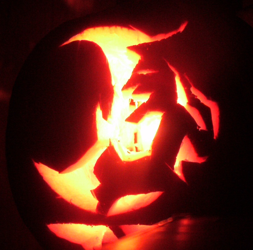 A Witch and her cauldron pumpkin carving.