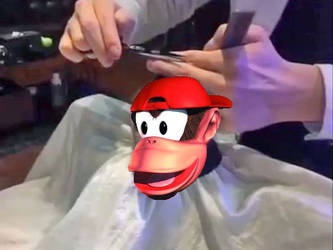 Monkey having a haircut but  it was Diddy Kong