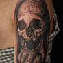 Skull holding skull