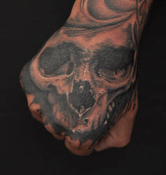 skull on hand by Robert-Franke