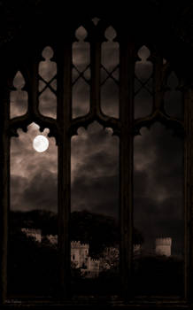 Gothic arched windows with view of castle