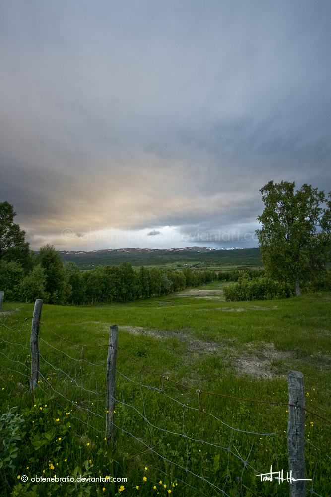 a fence and some clouds