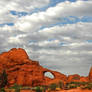 Skyline Arch and Clouds Above