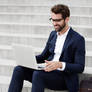 Stock-photo-smiling-businessman-using-laptop