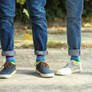 Stock-photo-gay-couple-colorful-socks-outdoors