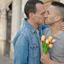 Stock-photo-two-men-couple-surprise-bouquet-flower