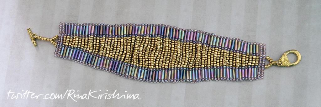 Gold and rainbow beaded bracelet