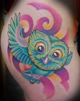 Hip owl tattoo
