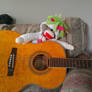 Unicorn monkey playing the guitar