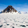 Arctic beauty of the frozen snow-capped mountains